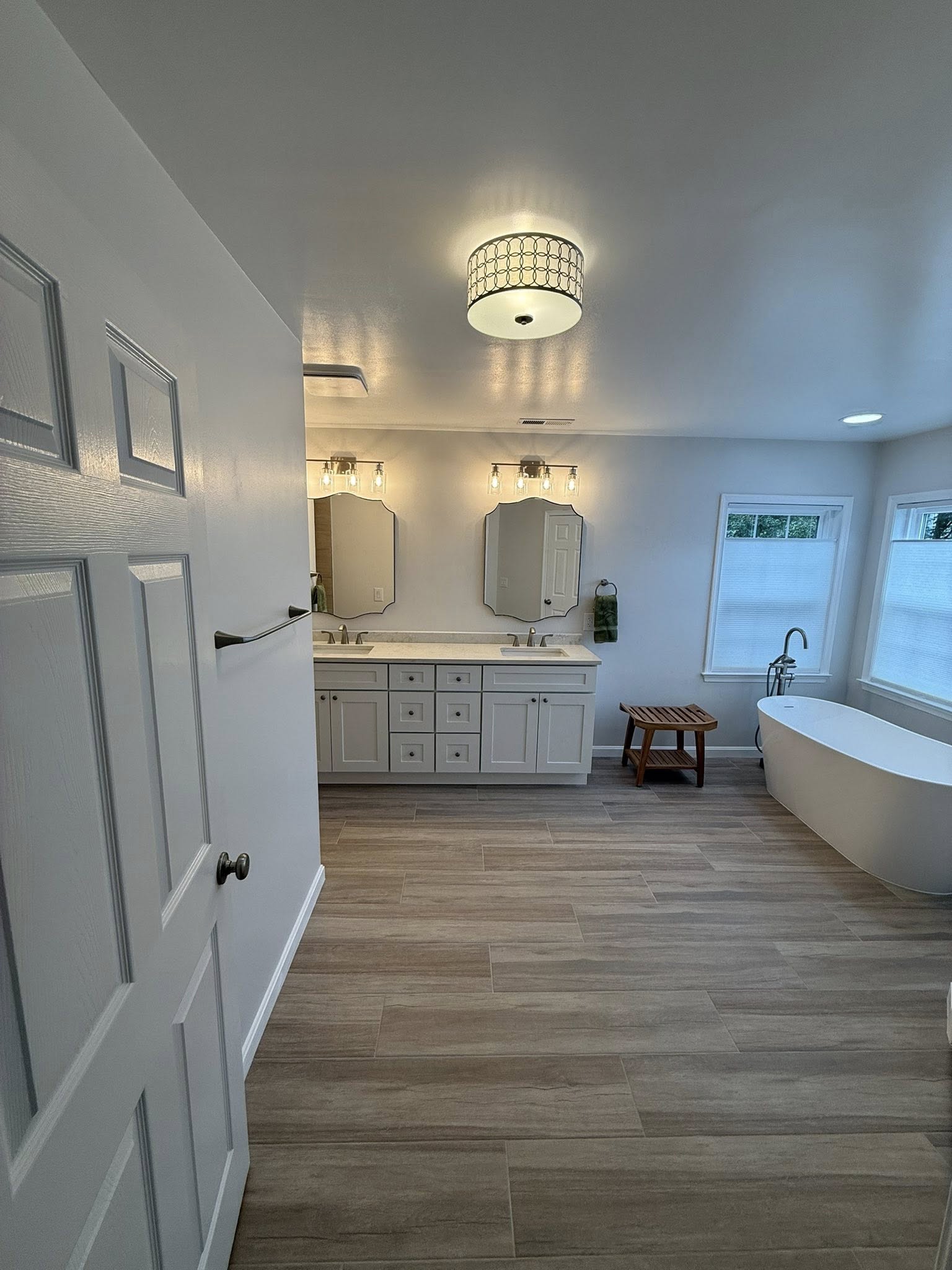 Bathroom renovation with updated tile, fixtures, and modern layout