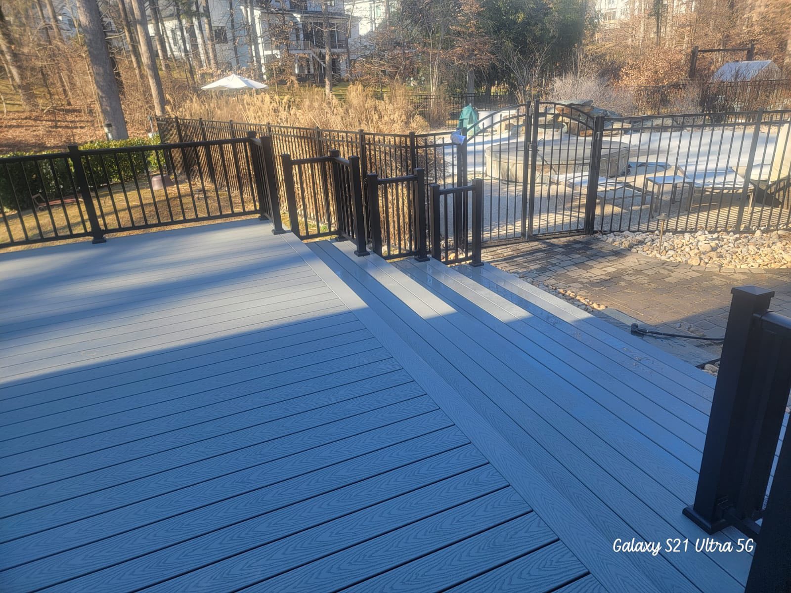 Deck renovation project showing woodwork craftsmanship and expanded outdoor space