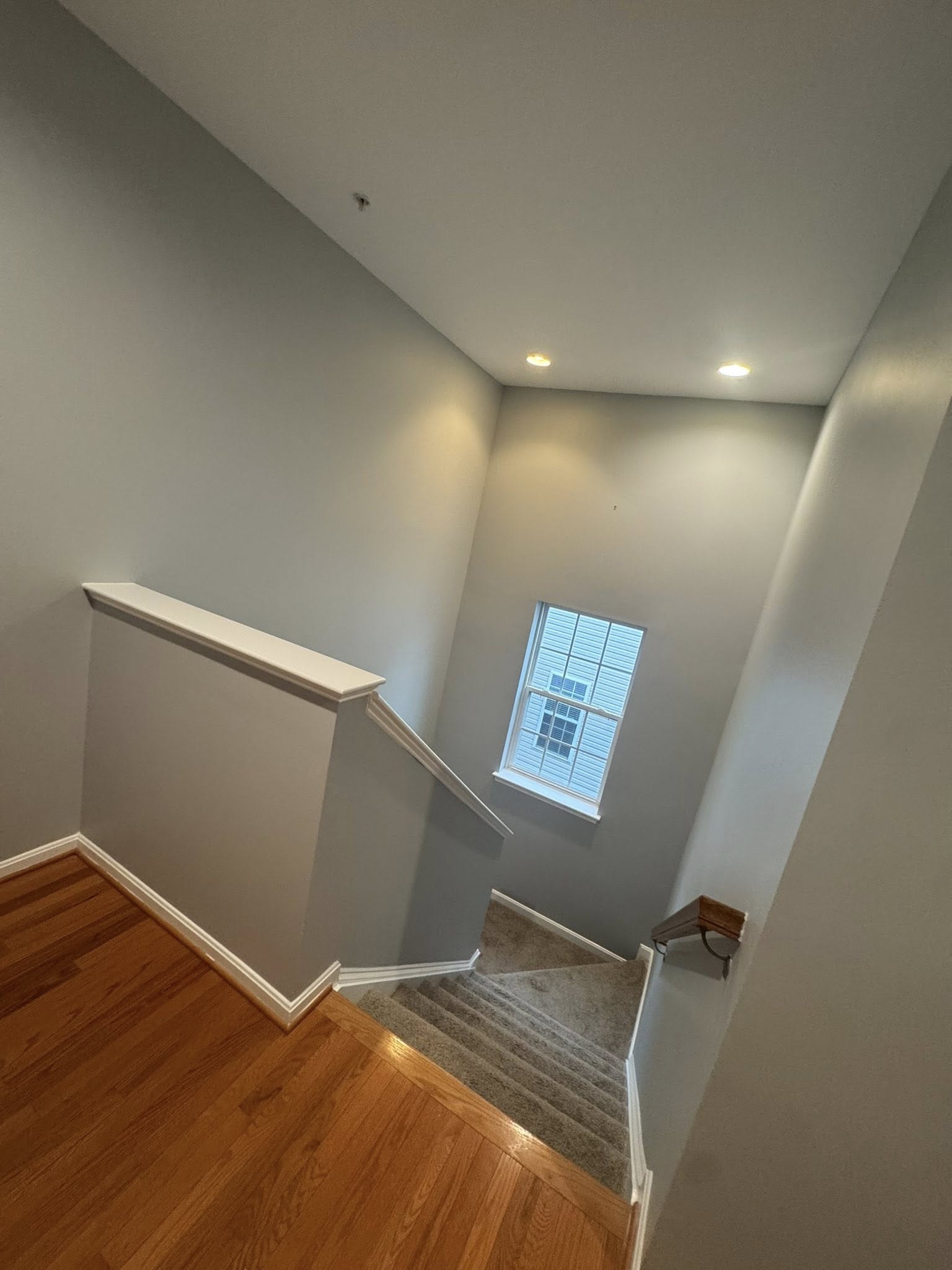 Large open-concept living area renovation with updated flooring and modern layout